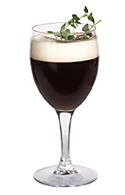 Picture of the CeeDee drink; made from gin, Kahlua, orange liqueur, hot coffee and whipped cream, and served in a white wine glass.