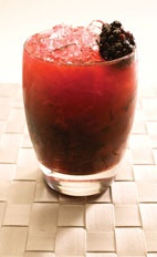 Blackberry Caipirinha - The Blackberry Caipirinha drink is made from Leblon Cachaca, lime, blackberries and sugar, and served in an old-fashioned glass.