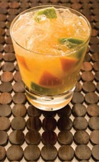 Citrus Twist - The Citrus Twist drink is made from cachaca, passionfruit flavored coconut water, lemon-lime soda, orange and lime, and served in an old-fashioned glass.