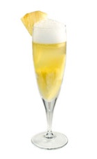 Pineapple Bash - The Pineapple Bash cocktail is made from champagne, pineapple juice and pineapple chunks, and served in a chilled champagne flute.