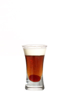 Blow Job - The Blow Job shot is made from creme de bananes, Mandarine Napoleon and Kahlua, and served in a shot glass.