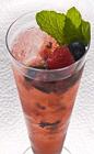 The Mixed Berry Mojito drink is made from cachaca, berries, mint, lime and brown sugar, and served in a highball glass.