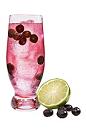 The Superfruit Soda drink is made from VeeV acai spirit, club soda, lime juice and blueberries, and served in a highball glass.